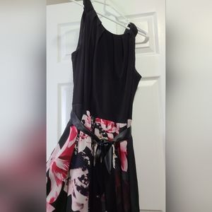 Gown black with long floral skirt.
